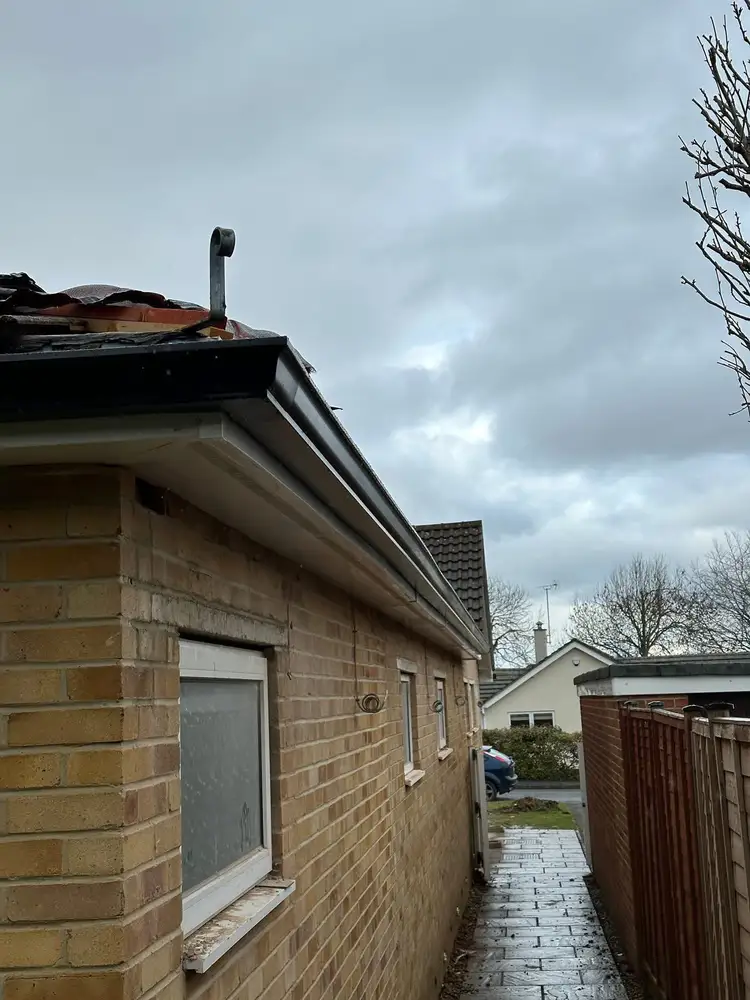 Black guttering with replacement fascia and soffit installed by Gutterworx