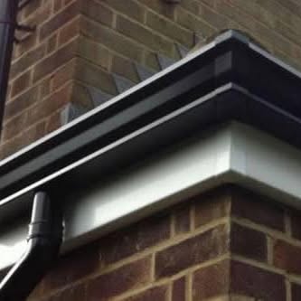 Black seamless aluminium guttering installed by Gutterworx